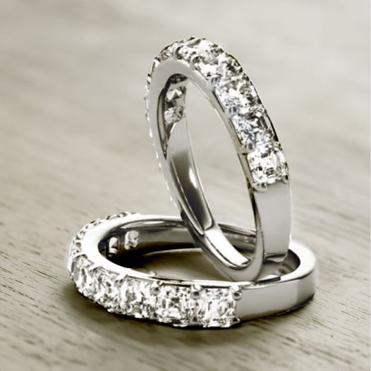 Two nine stone diamond rings in mixed diamond shapes in platinum.