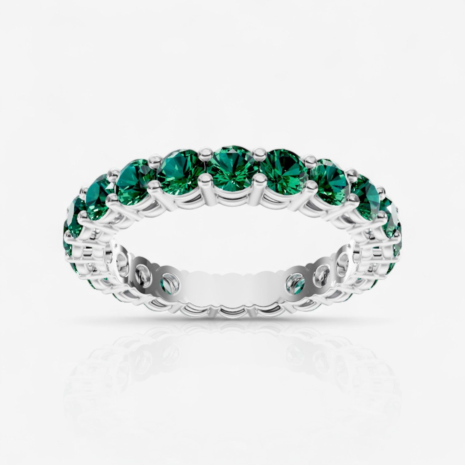 Round Shared Prong Emerald Eternity Band