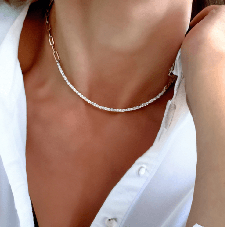 a woman wearing a diamond tennis necklace