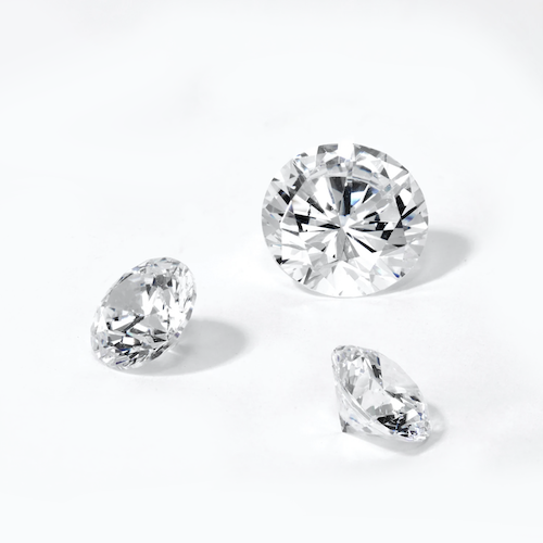 loose diamonds on a white background